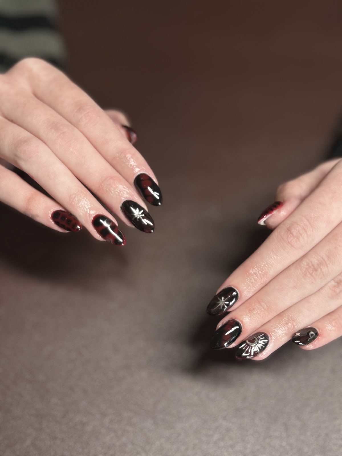 Black chrome nails with star art